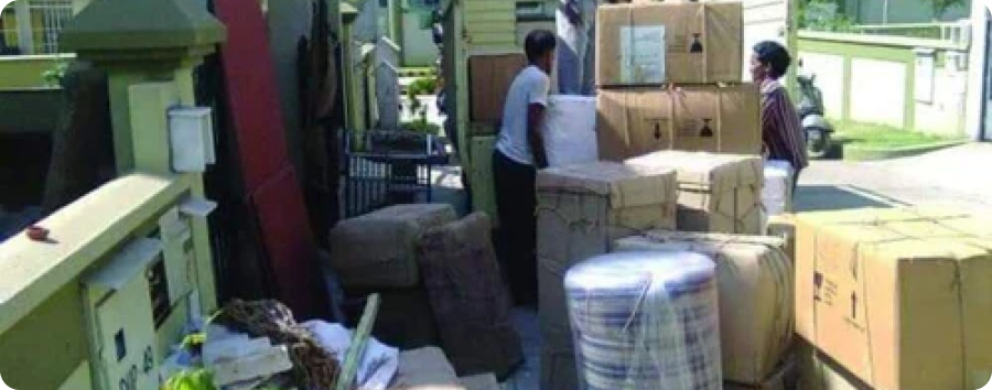 Furniture movers in Ajman loading a moving truck